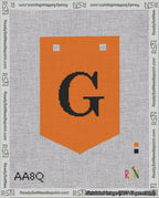 A taped needlepoint canvas with the design: Banner 18 mesh count Pointed G Black on Orange.