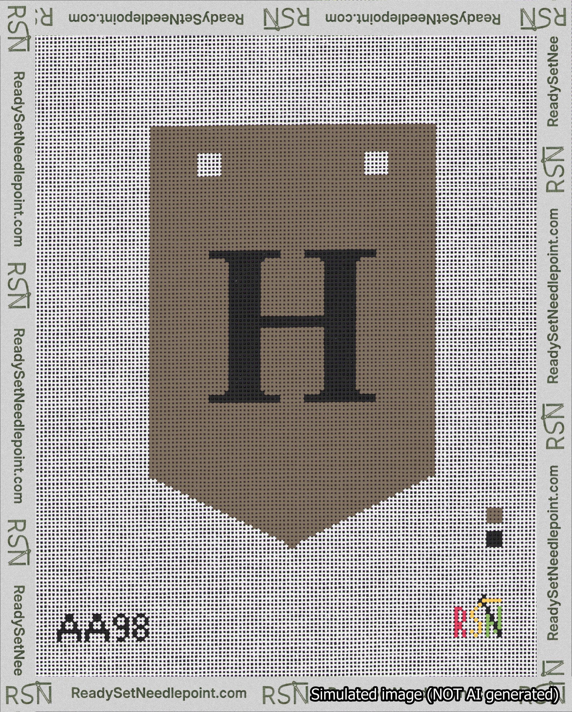 A taped needlepoint canvas with the design: Banner 18 mesh count Pointed H Black on Brown.