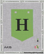 A taped needlepoint canvas with the design: Banner 18 mesh count Pointed H Black on Light Green.
