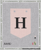 A taped needlepoint canvas with the design: Banner 18 mesh count Pointed H Black on Pink.