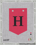 A taped needlepoint canvas with the design: Banner 18 mesh count Pointed H Black on Red.