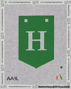 A taped needlepoint canvas with the design: Banner 18 mesh count Pointed H White on Green.