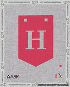 A taped needlepoint canvas with the design: Banner 18 mesh count Pointed H White on Red.