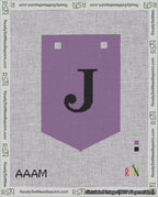 A taped needlepoint canvas with the design: Banner 18 mesh count Pointed J Black on Purple.