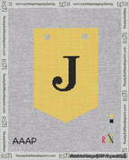 A taped needlepoint canvas with the design: Banner 18 mesh count Pointed J Black on Yellow.