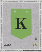 A taped needlepoint canvas with the design: Banner 18 mesh count Pointed K Black on Light Green.