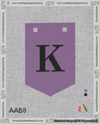 A taped needlepoint canvas with the design: Banner 18 mesh count Pointed K Black on Purple.