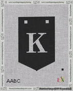 A taped needlepoint canvas with the design: Banner 18 mesh count Pointed K White on Black.
