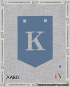 A taped needlepoint canvas with the design: Banner 18 mesh count Pointed K White on Blue.
