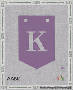 A taped needlepoint canvas with the design: Banner 18 mesh count Pointed K White on Purple.