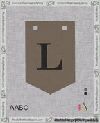 A taped needlepoint canvas with the design: Banner 18 mesh count Pointed L Black on Brown.