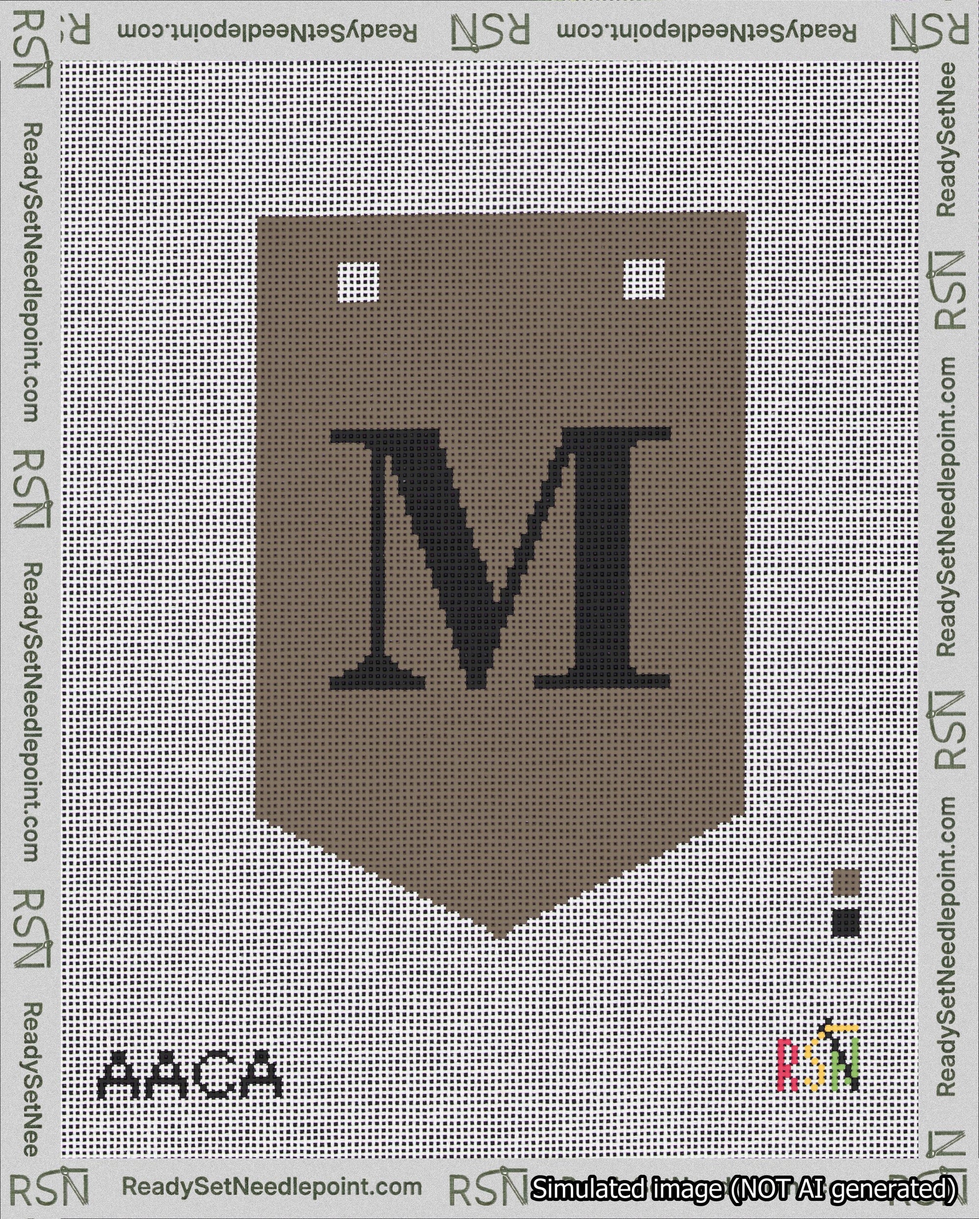 A taped needlepoint canvas with the design: Banner 18 mesh count Pointed M Black on Brown.