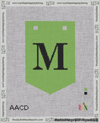 A taped needlepoint canvas with the design: Banner 18 mesh count Pointed M Black on Light Green.