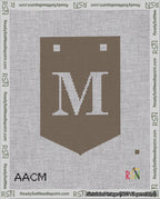 A taped needlepoint canvas with the design: Banner 18 mesh count Pointed M White on Brown.