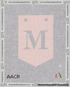 A taped needlepoint canvas with the design: Banner 18 mesh count Pointed M White on Pink.
