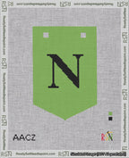 A taped needlepoint canvas with the design: Banner 18 mesh count Pointed N Black on Light Green.