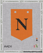 A taped needlepoint canvas with the design: Banner 18 mesh count Pointed N Black on Orange.