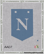 A taped needlepoint canvas with the design: Banner 18 mesh count Pointed N White on Blue.