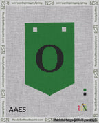 A taped needlepoint canvas with the design: Banner 18 mesh count Pointed O Black on Green.