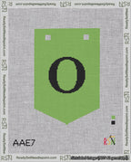 A taped needlepoint canvas with the design: Banner 18 mesh count Pointed O Black on Light Green.