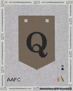 A taped needlepoint canvas with the design: Banner 18 mesh count Pointed Q Black on Brown.