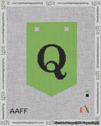 A taped needlepoint canvas with the design: Banner 18 mesh count Pointed Q Black on Light Green.