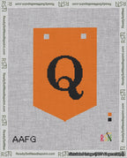 A taped needlepoint canvas with the design: Banner 18 mesh count Pointed Q Black on Orange.