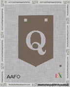 A taped needlepoint canvas with the design: Banner 18 mesh count Pointed Q White on Brown.