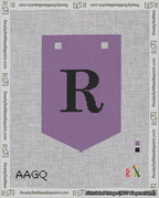 A taped needlepoint canvas with the design: Banner 18 mesh count Pointed R Black on Purple.