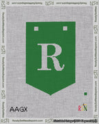 A taped needlepoint canvas with the design: Banner 18 mesh count Pointed R White on Green.