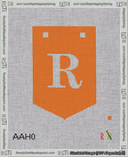 A taped needlepoint canvas with the design: Banner 18 mesh count Pointed R White on Orange.