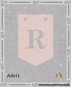 A taped needlepoint canvas with the design: Banner 18 mesh count Pointed R White on Pink.