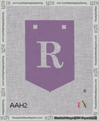 A taped needlepoint canvas with the design: Banner 18 mesh count Pointed R White on Purple.