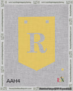 A taped needlepoint canvas with the design: Banner 18 mesh count Pointed R White on Yellow.