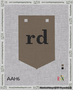 A taped needlepoint canvas with the design: Banner 18 mesh count Pointed rd Black on Brown.