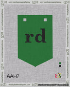A taped needlepoint canvas with the design: Banner 18 mesh count Pointed rd Black on Green.