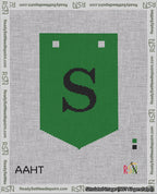 A taped needlepoint canvas with the design: Banner 18 mesh count Pointed S Black on Green.