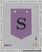 A taped needlepoint canvas with the design: Banner 18 mesh count Pointed S Black on Purple.