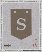 A taped needlepoint canvas with the design: Banner 18 mesh count Pointed S White on Brown.