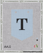 A taped needlepoint canvas with the design: Banner 18 mesh count Pointed T Black on Light Blue.