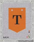 A taped needlepoint canvas with the design: Banner 18 mesh count Pointed T Black on Orange.