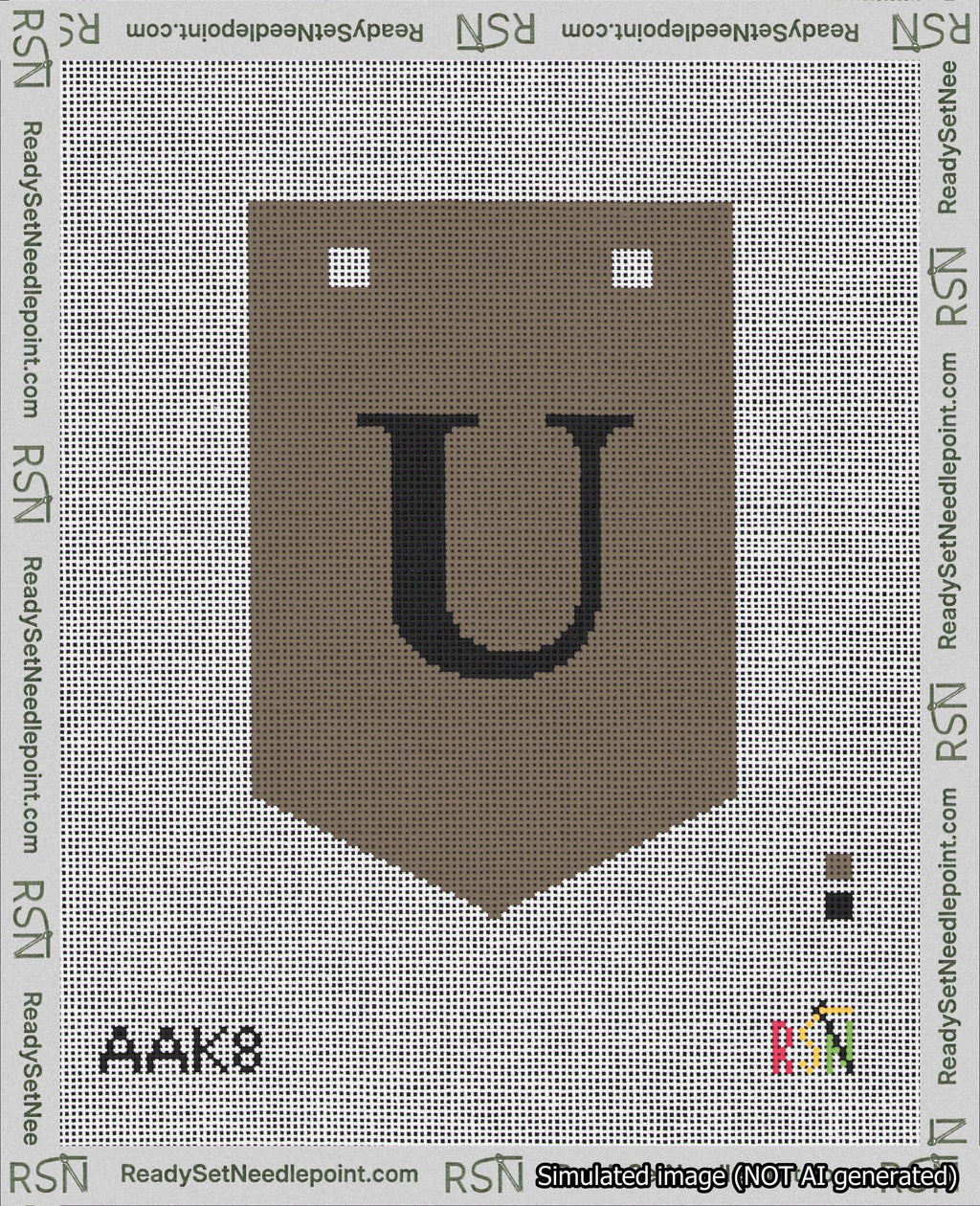 A taped needlepoint canvas with the design: Banner 18 mesh count Pointed U Black on Brown.