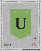 A taped needlepoint canvas with the design: Banner 18 mesh count Pointed U Black on Light Green.