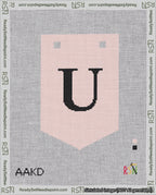 A taped needlepoint canvas with the design: Banner 18 mesh count Pointed U Black on Pink.