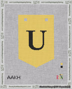 A taped needlepoint canvas with the design: Banner 18 mesh count Pointed U Black on Yellow.