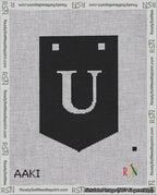 A taped needlepoint canvas with the design: Banner 18 mesh count Pointed U White on Black.