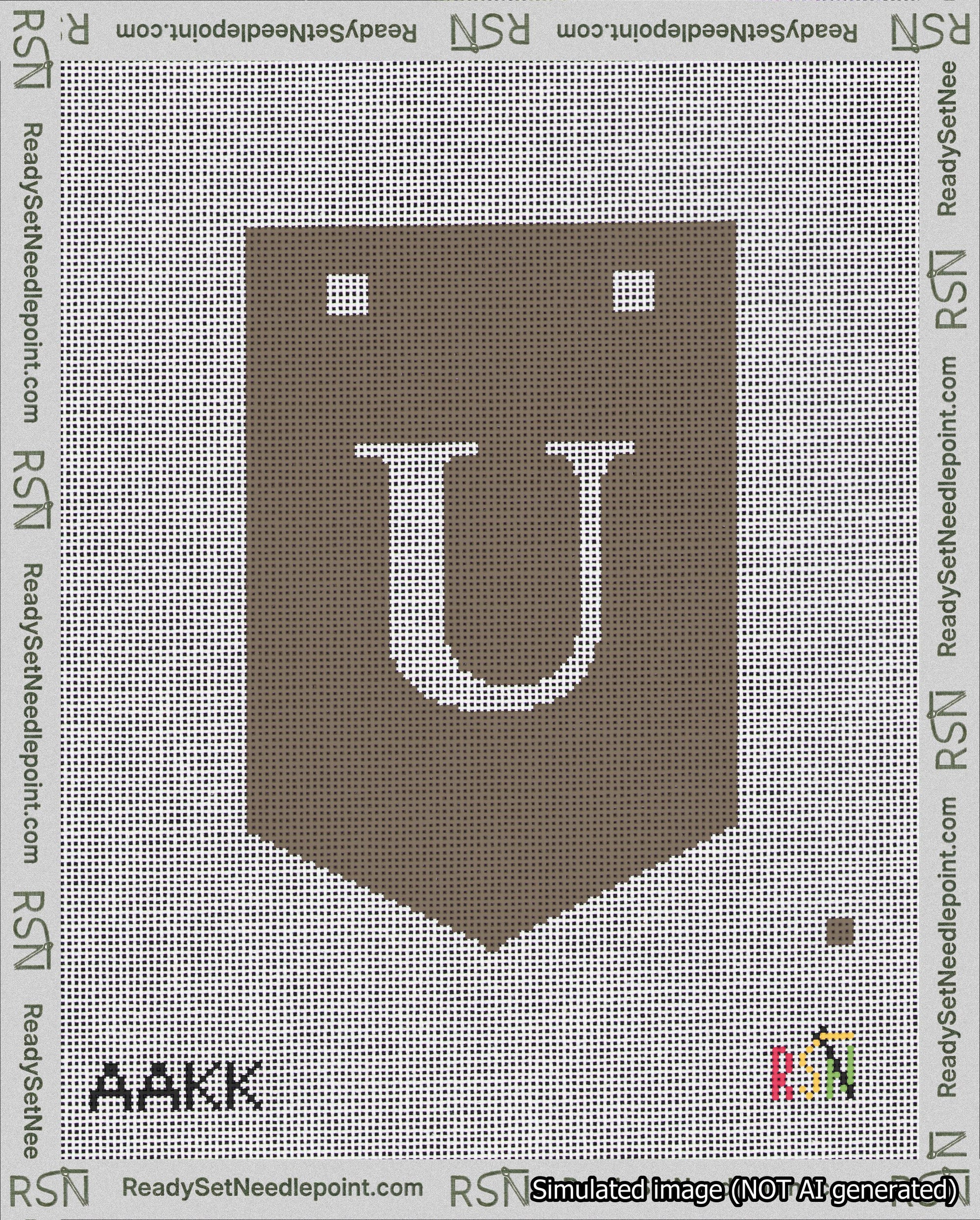 A taped needlepoint canvas with the design: Banner 18 mesh count Pointed U White on Brown.