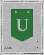 A taped needlepoint canvas with the design: Banner 18 mesh count Pointed U White on Green.