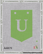 A taped needlepoint canvas with the design: Banner 18 mesh count Pointed U White on Light Green.