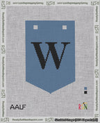 A taped needlepoint canvas with the design: Banner 18 mesh count Pointed W Black on Blue.
